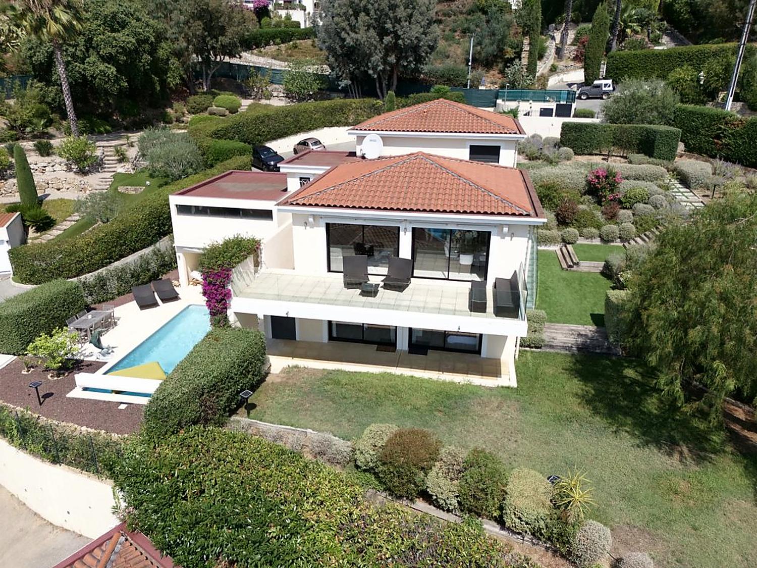 The villa, its terraces and pool seen from above